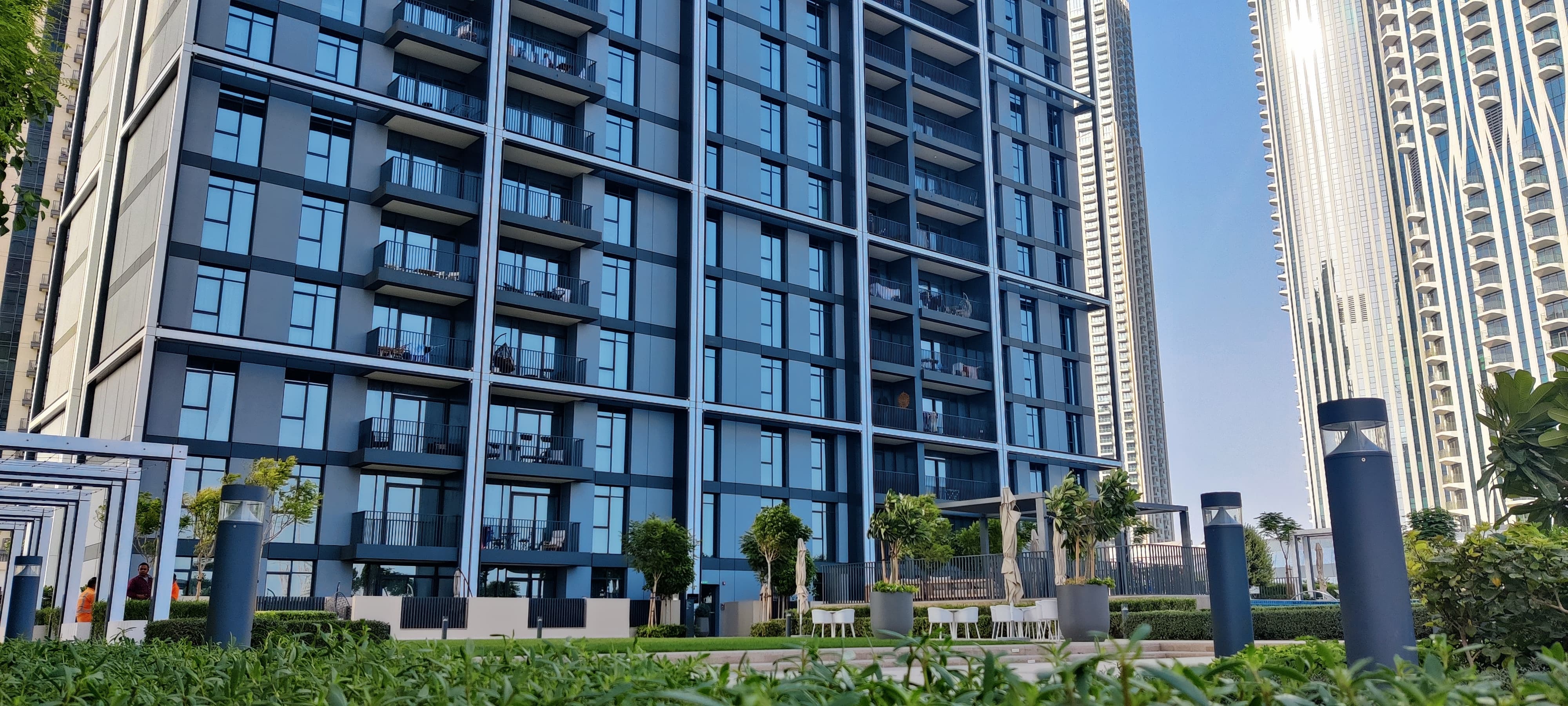 Creek Edge mixed-use development with glazed façades overlooking the water